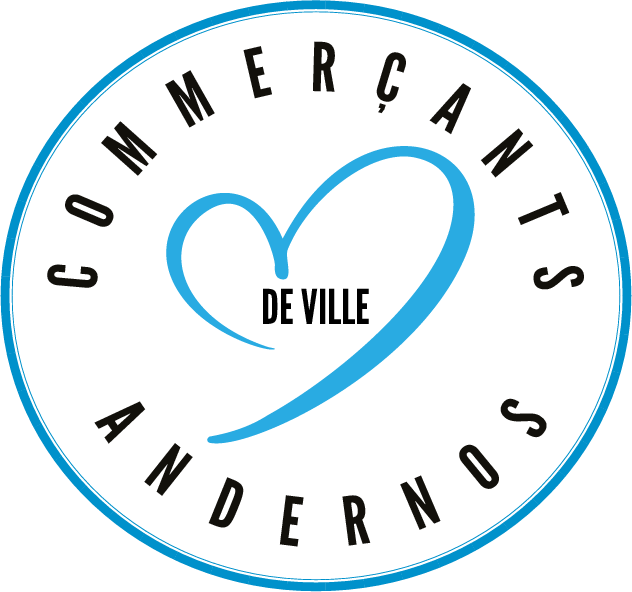 Un logo circulaire avec "Commerçants Andernos" sur le pourtour et un grand cœur bleu au centre. À l'intérieur du cœur, les mots "DE VILLE" apparaissent en noir.
